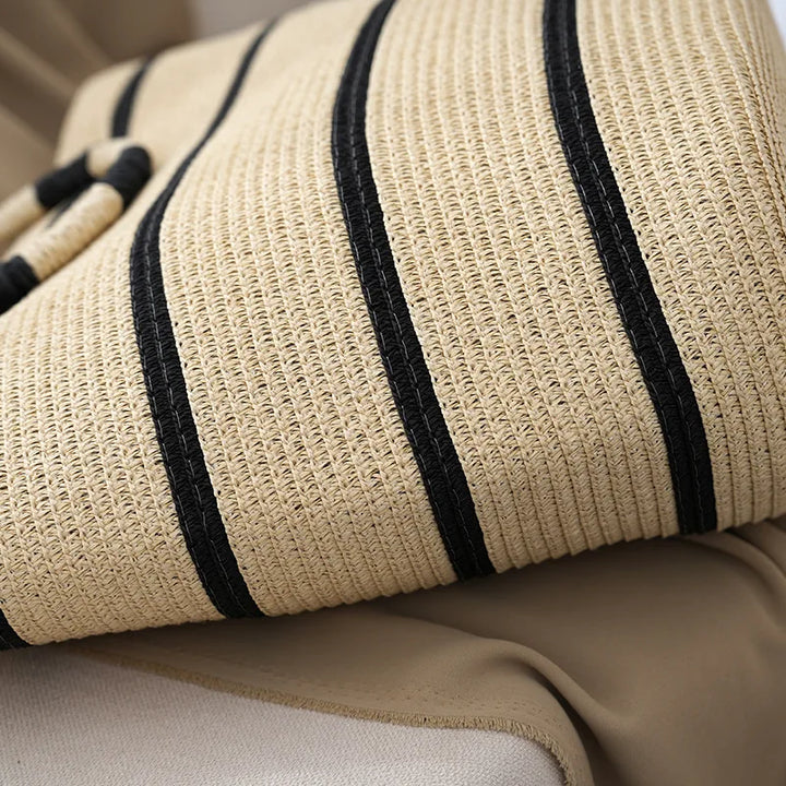 Close-up of a women's striped beach tote bag featuring elegant stripes and sturdy woven rope handles.