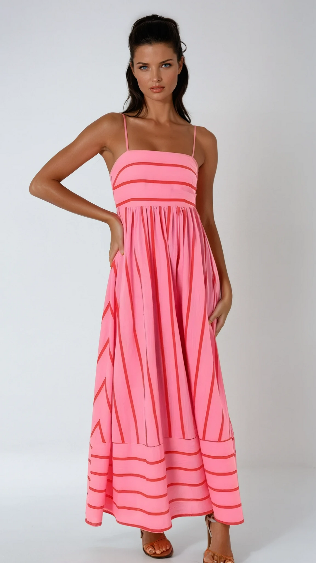 Women's striped strappy maxi dress for summer beach days and vacation.