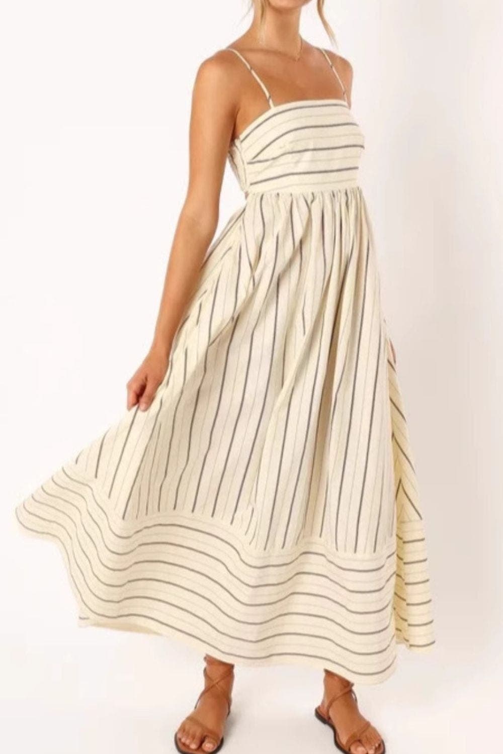 Enjoy summer in this women's striped strappy maxi dress, perfect for beach adventures.
