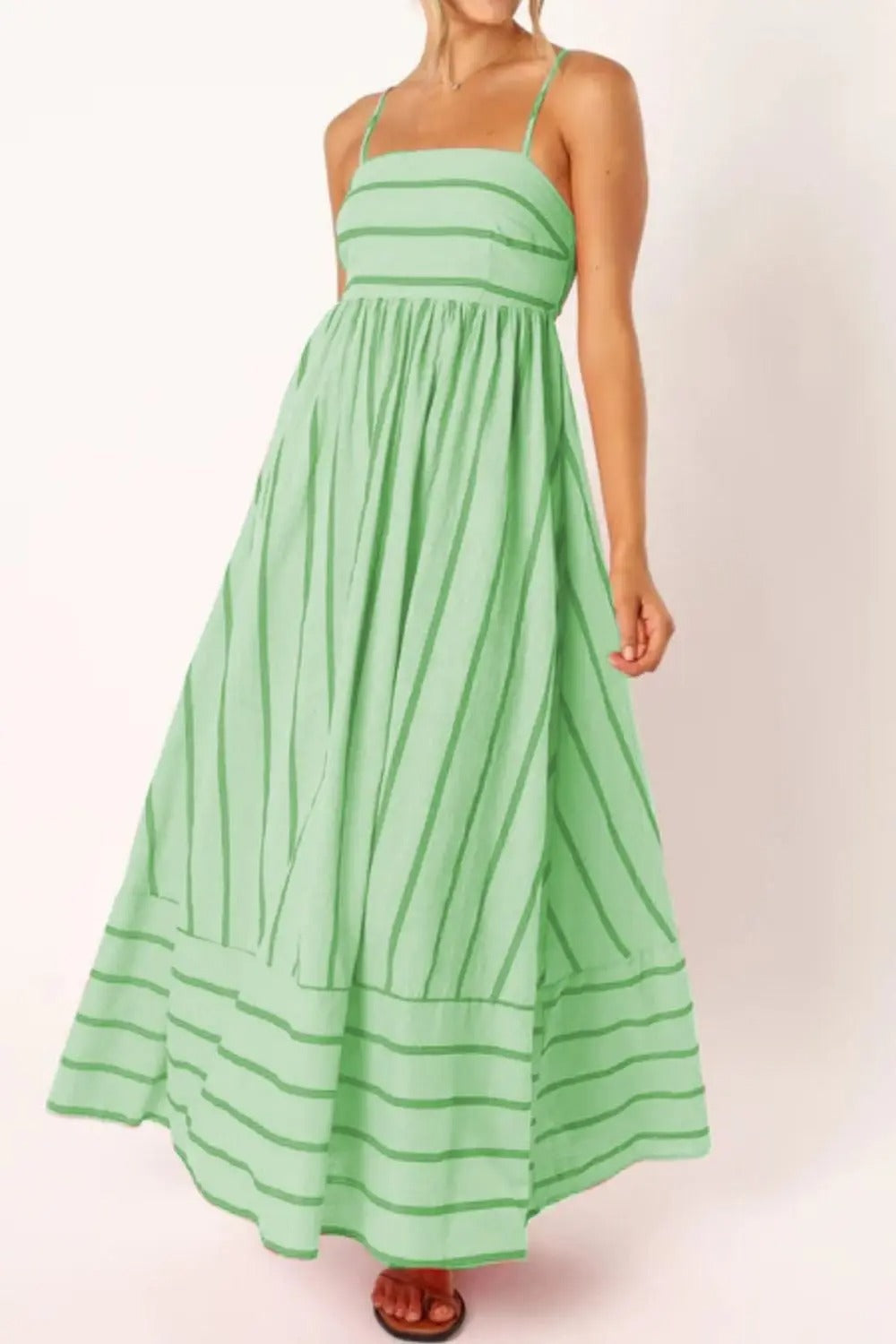 Beautifully striped women's strappy maxi dress, perfect flowy summer beachwear.