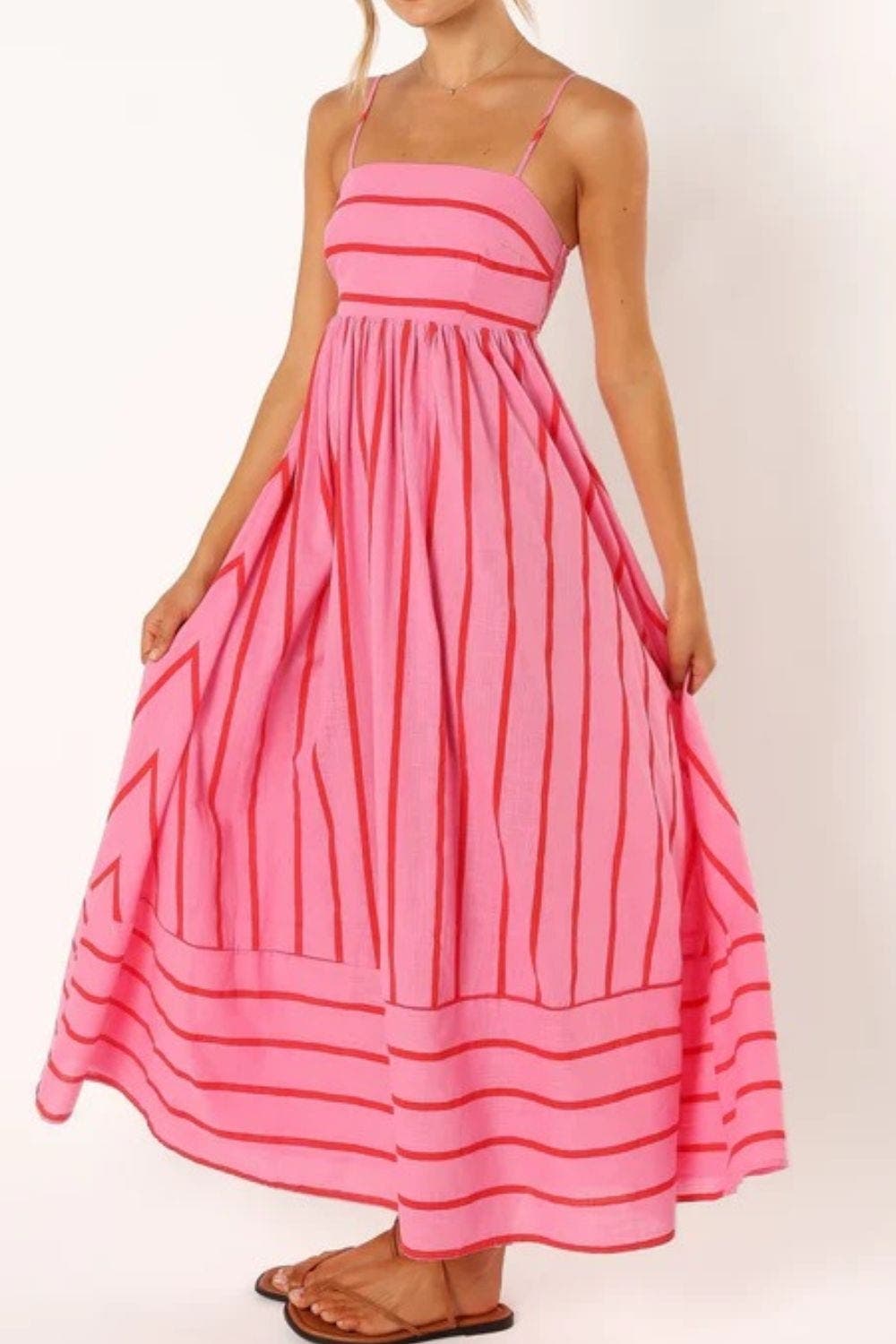 Versatile striped strappy maxi dress for women, great for summer beach or vacation.