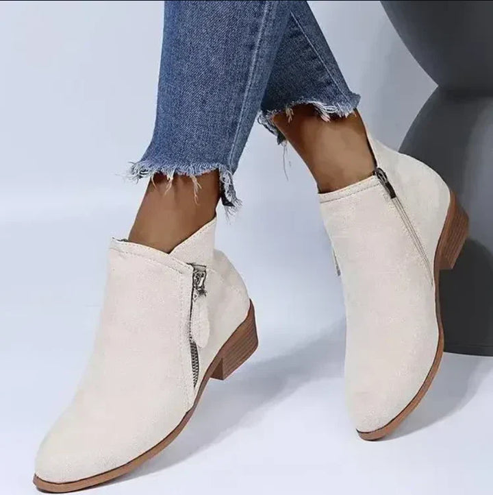 Women's stylish black leather ankle boots, comfortable for all-day wear.