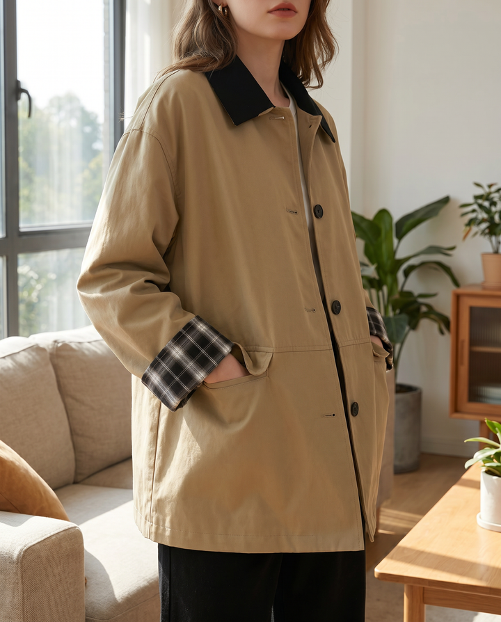 Women's button-up jacket with contrast plaid trim. A stylish, versatile layering piece for fall chic.