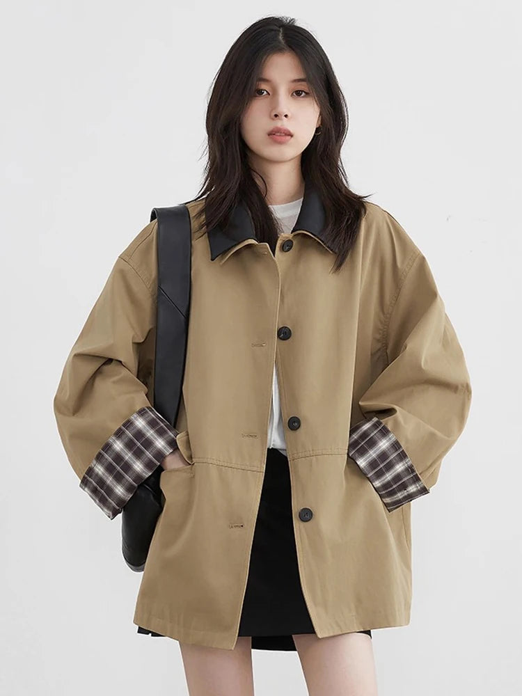 Effortlessly chic women's button-up jacket. Contrast trim details elevate this stylish casual outerwear.
