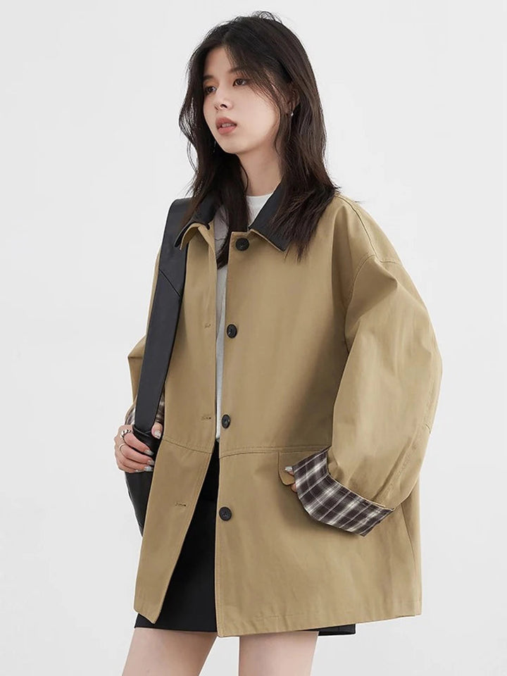 Women's stylish button-up jacket with contrast trim. Chic and versatile casual outerwear for any season.