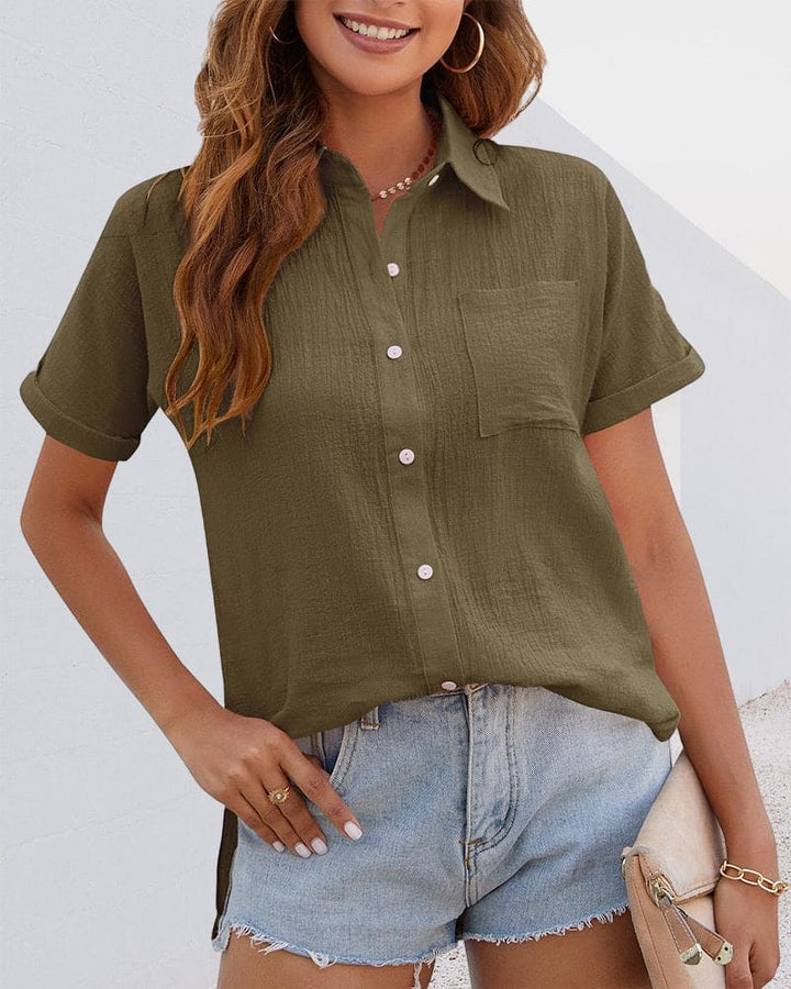 Classic women's short sleeve button blouse made from soft cotton, offering comfortable style for various occasions.