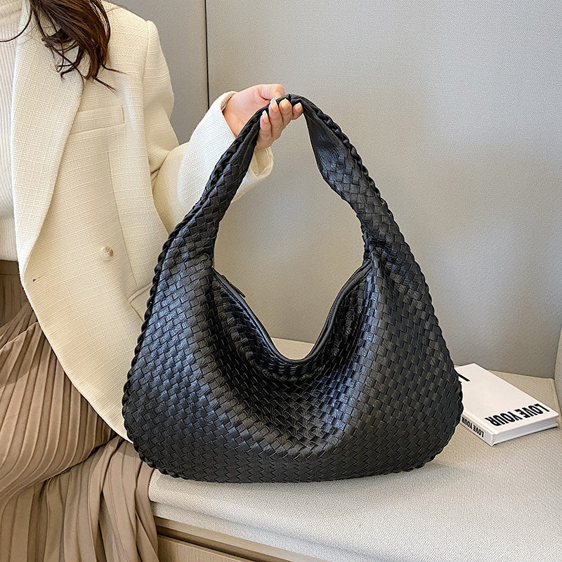 Women's sophisticated woven shoulder tote bag, ideal for carrying essentials to work or daily use.