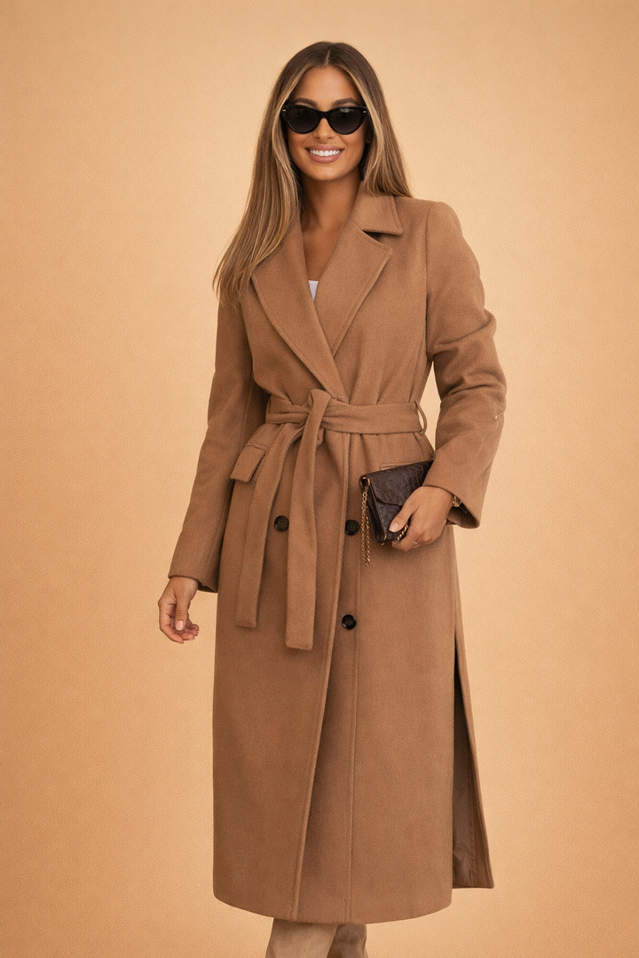 Stylish women's longline winter jacket with belt, featuring a sophisticated tailored design for city chic elegance.