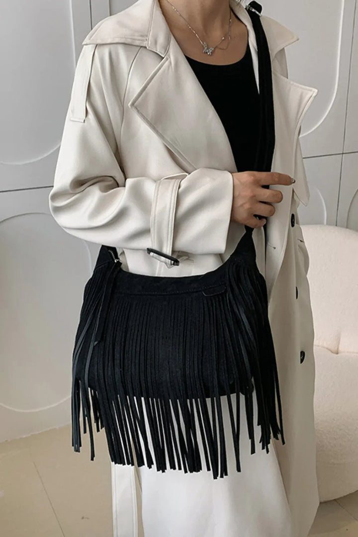 Soft leatherette fringe on a chic boho women's handbag.