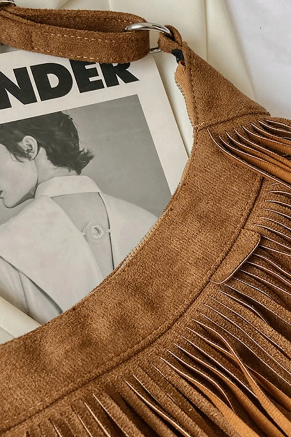 Beige suede fringe bag, ideal as a casual boho crossbody.
