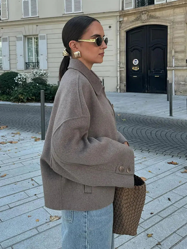 Model wearing a chic taupe wool blend boxy cropped jacket, styled for winter.