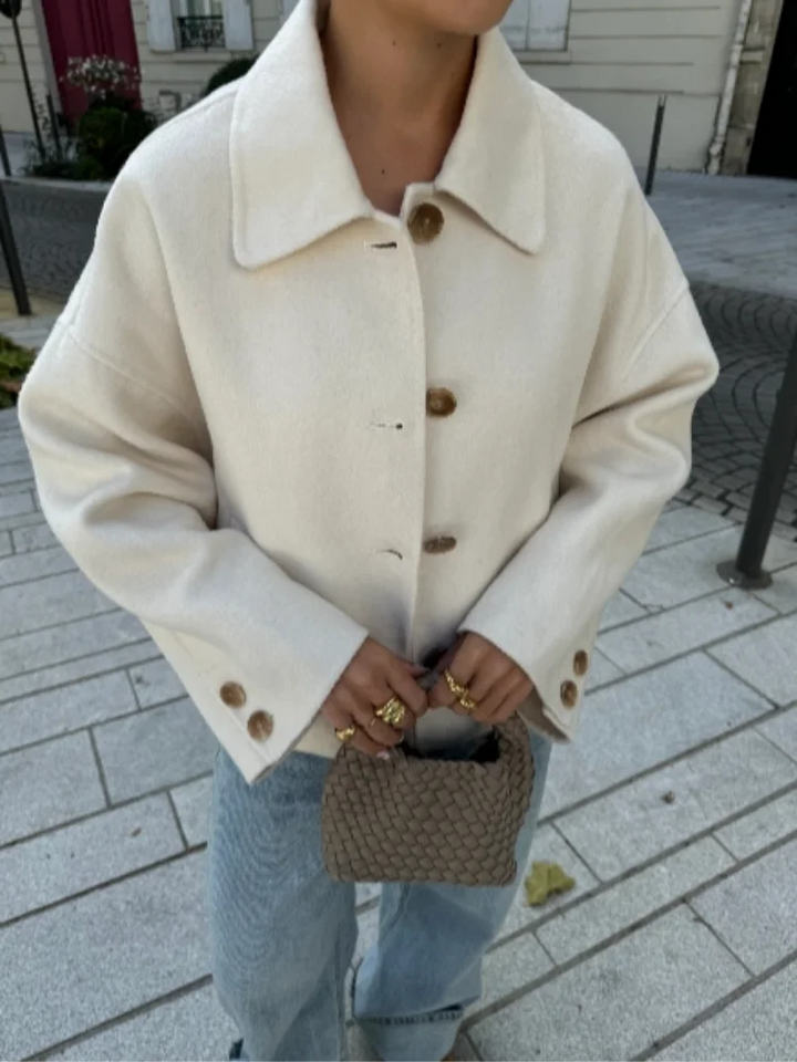 Front view of a women's oversized cream cropped wool blend coat. Essential outerwear.
