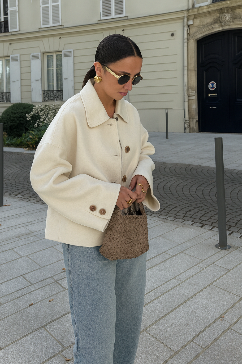Back view of a women's taupe boxy cropped wool blend jacket, showing the relaxed fit.