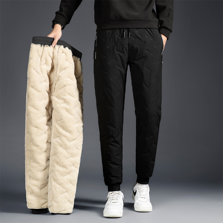 Women's thermal waterproof trousers for winter outdoor adventures. Durable & comfortable straight leg hiking pants.