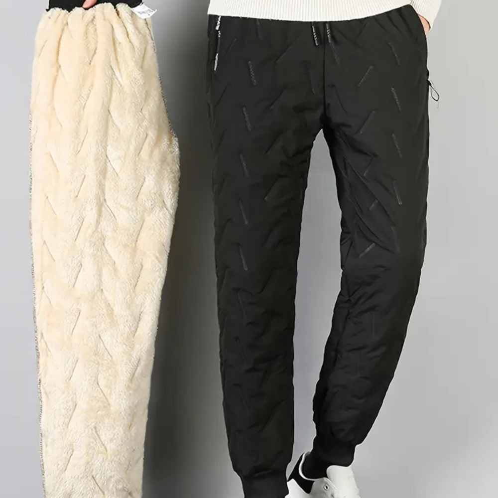 Women's waterproof trousers for superior protection in wet conditions. Durable thermal pants for outdoor adventure & winter wear.