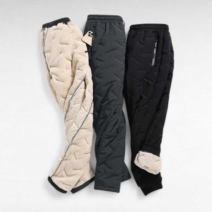 Back view of women's thermal waterproof straight leg trousers. Durable & comfortable winter wear for hiking & outdoor activities.