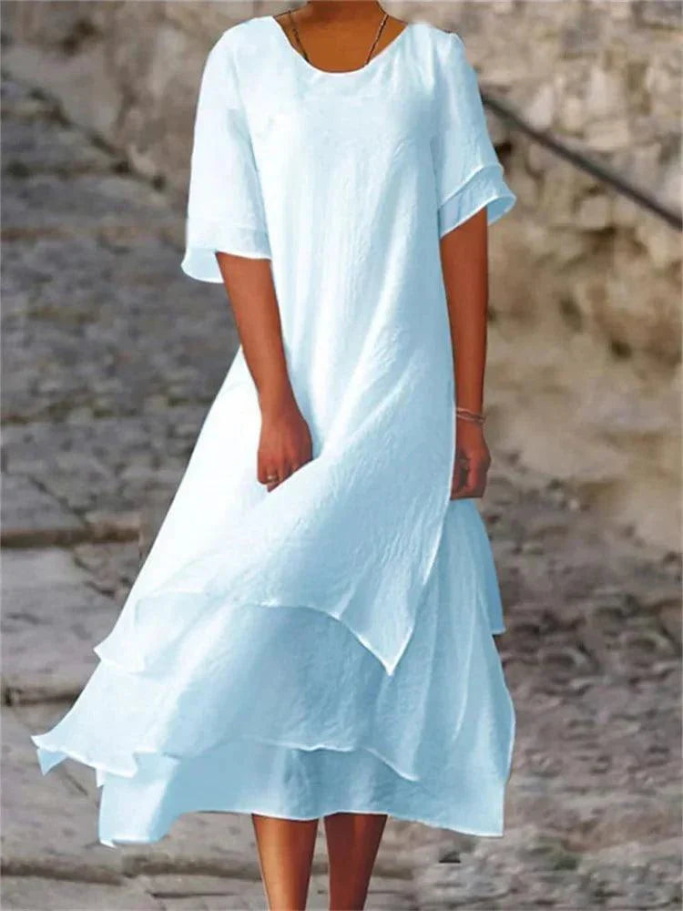 Comfortable women's tiered A-line midi dress. Effortlessly chic short sleeve style, perfect for spring/summer fashion.