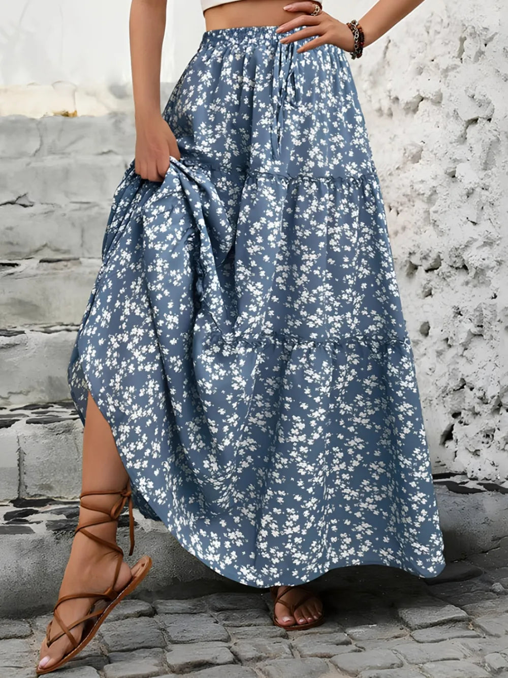 Close-up of the delicate floral print on a women's summer maxi skirt, ideal for casual wear.
