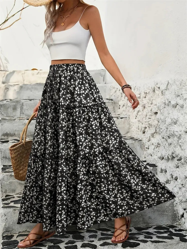 Side view of a long, boho-inspired floral maxi skirt with tiered detailing for women.