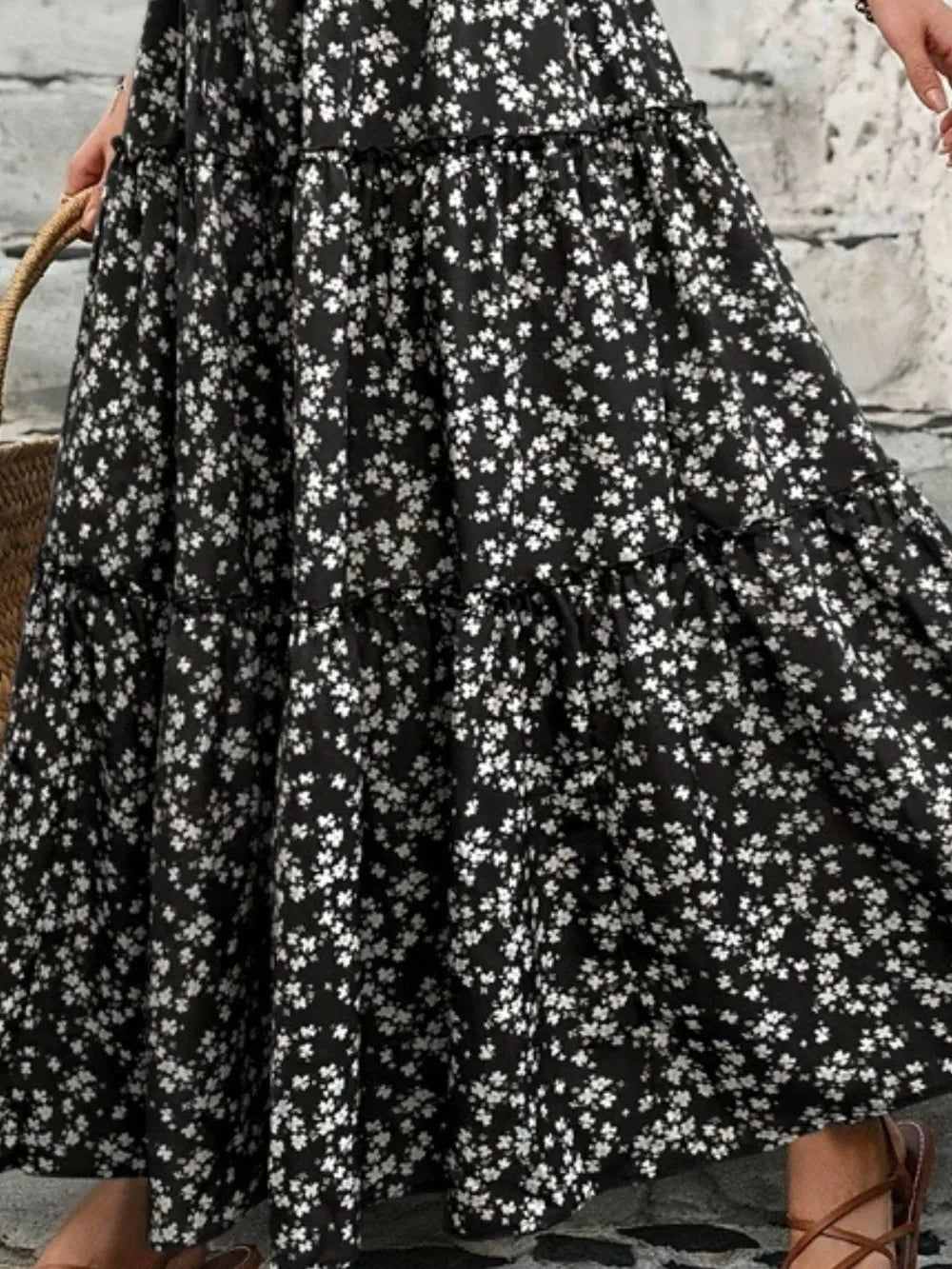 Detailed shot of the fabric and tiers on a women's casual summer floral maxi skirt.