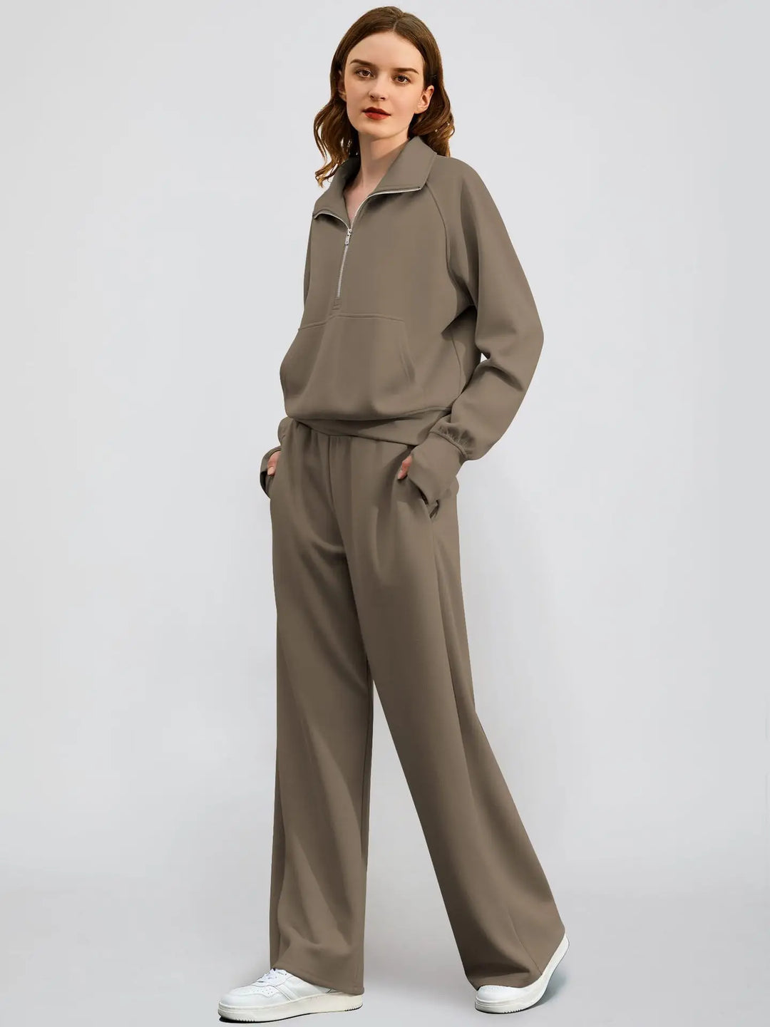 Solid color women's athleisure set: casual half zip sweatshirt paired with trendy wide-leg trousers.