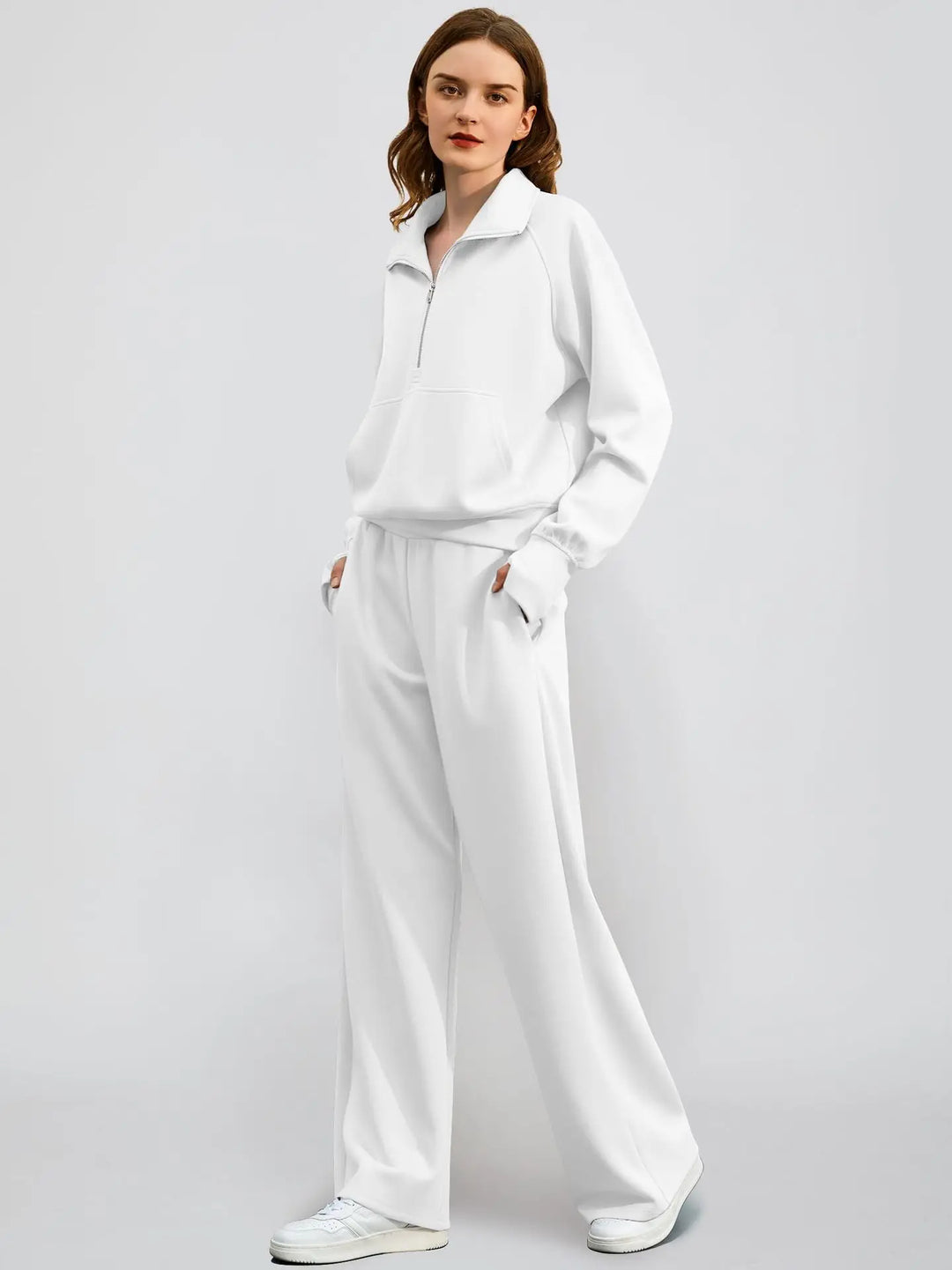Fashionable two-piece outfit for women: long-sleeved half zip top and matching wide-leg lounge pants.