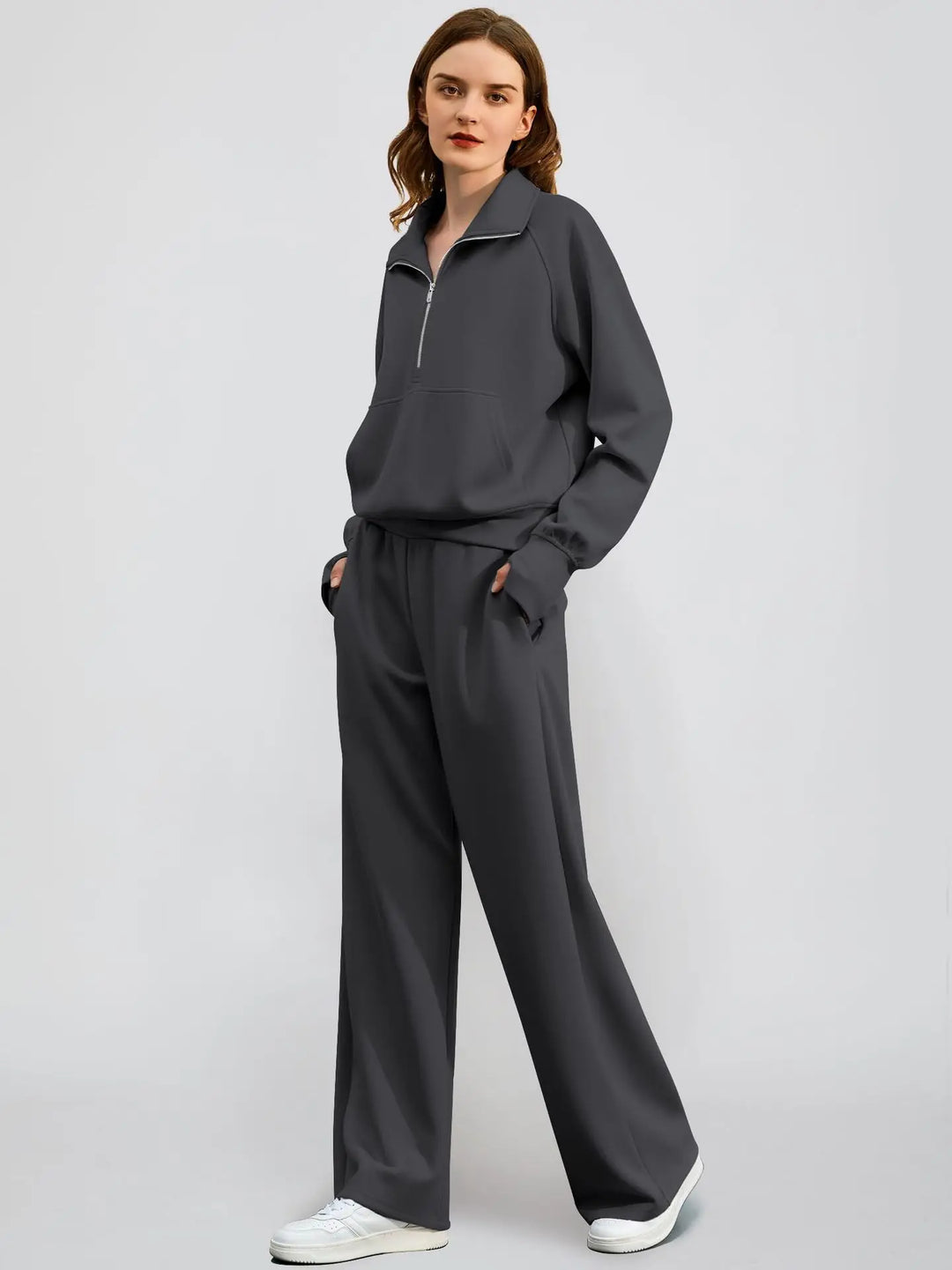 Relaxed fit women's sweatshirt set, perfect for leisure, with a half zip neckline and wide leg bottoms.