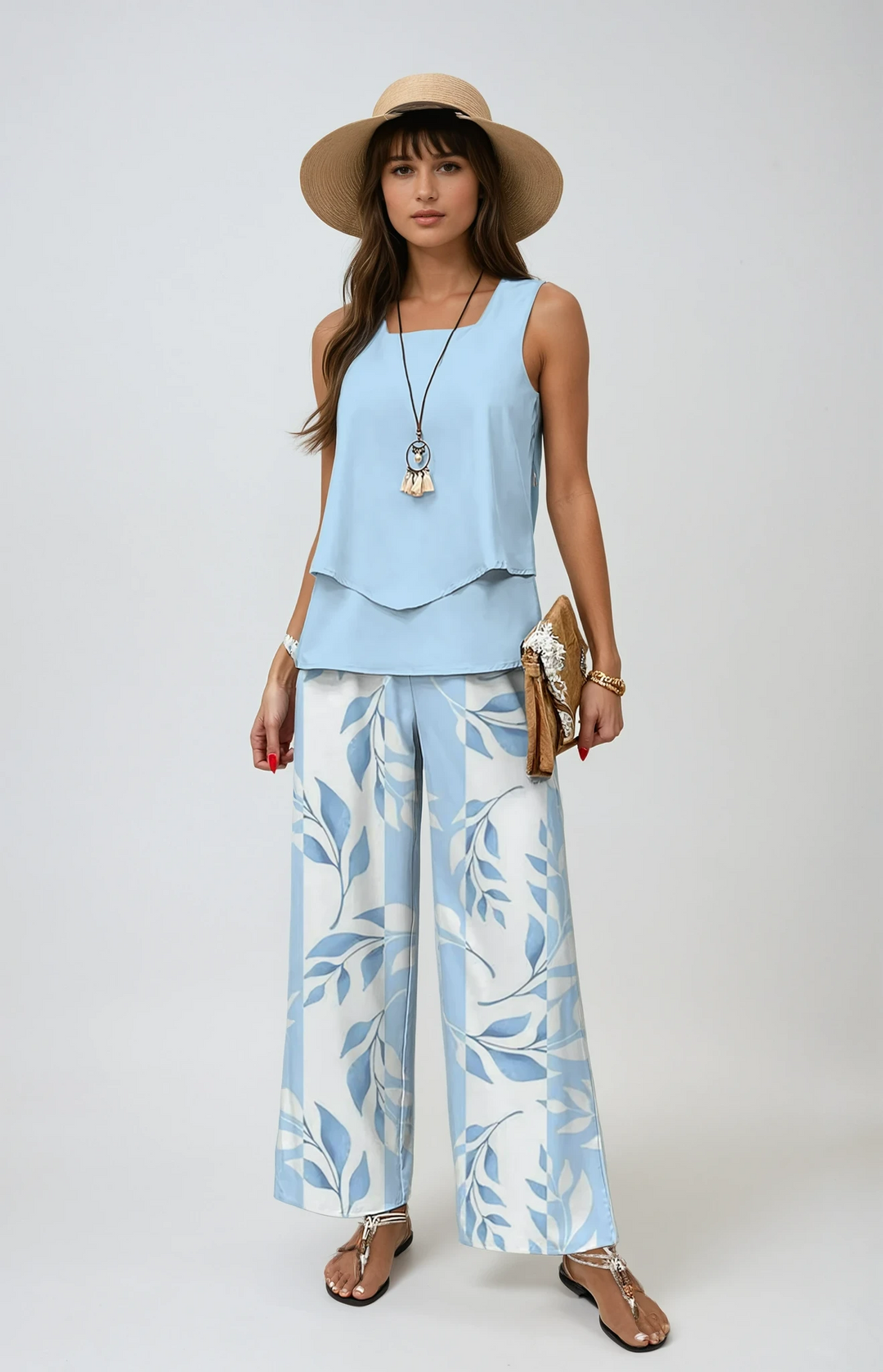 Women's two-piece summer set with a breezy top & wide-leg botanical print pants, perfect for vacation.