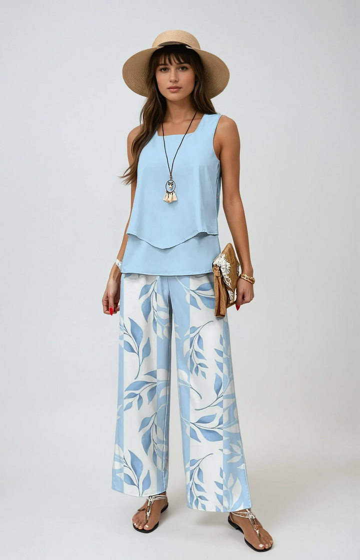 Women's two-piece summer set with a breezy top & wide-leg botanical print pants, perfect for vacation.