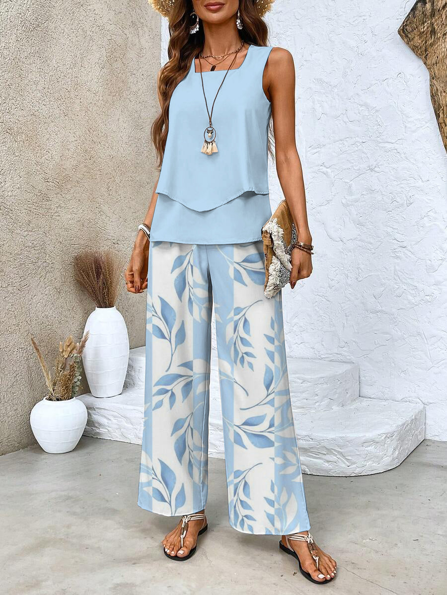 Flowy women's two-piece summer outfit featuring a lightweight top & wide-leg pants for casual elegance.
