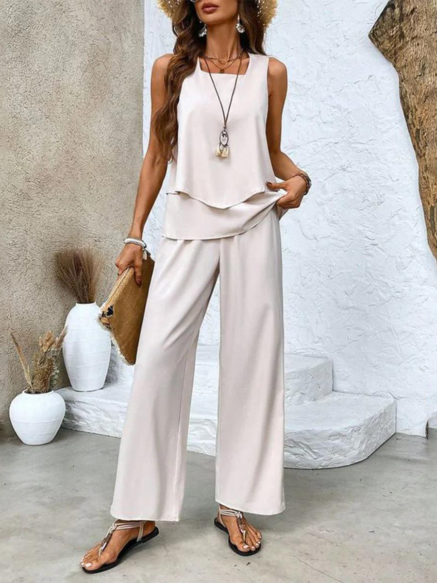 Relaxed women's two-piece summer outfit with a comfortable breezy top and stylish wide-leg vacation pants.