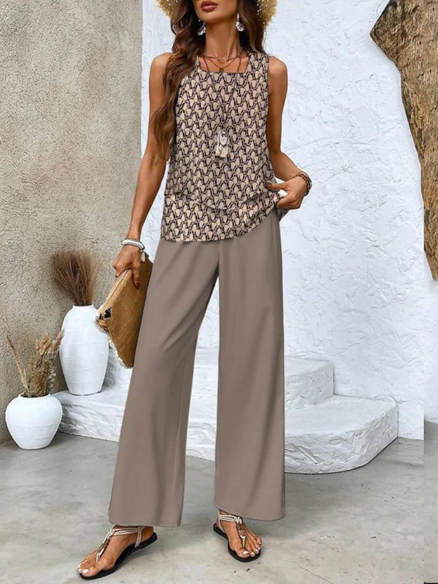 Elegant women's two-piece set for summer. Features a flowy top & wide-leg pants with a beautiful botanical print.