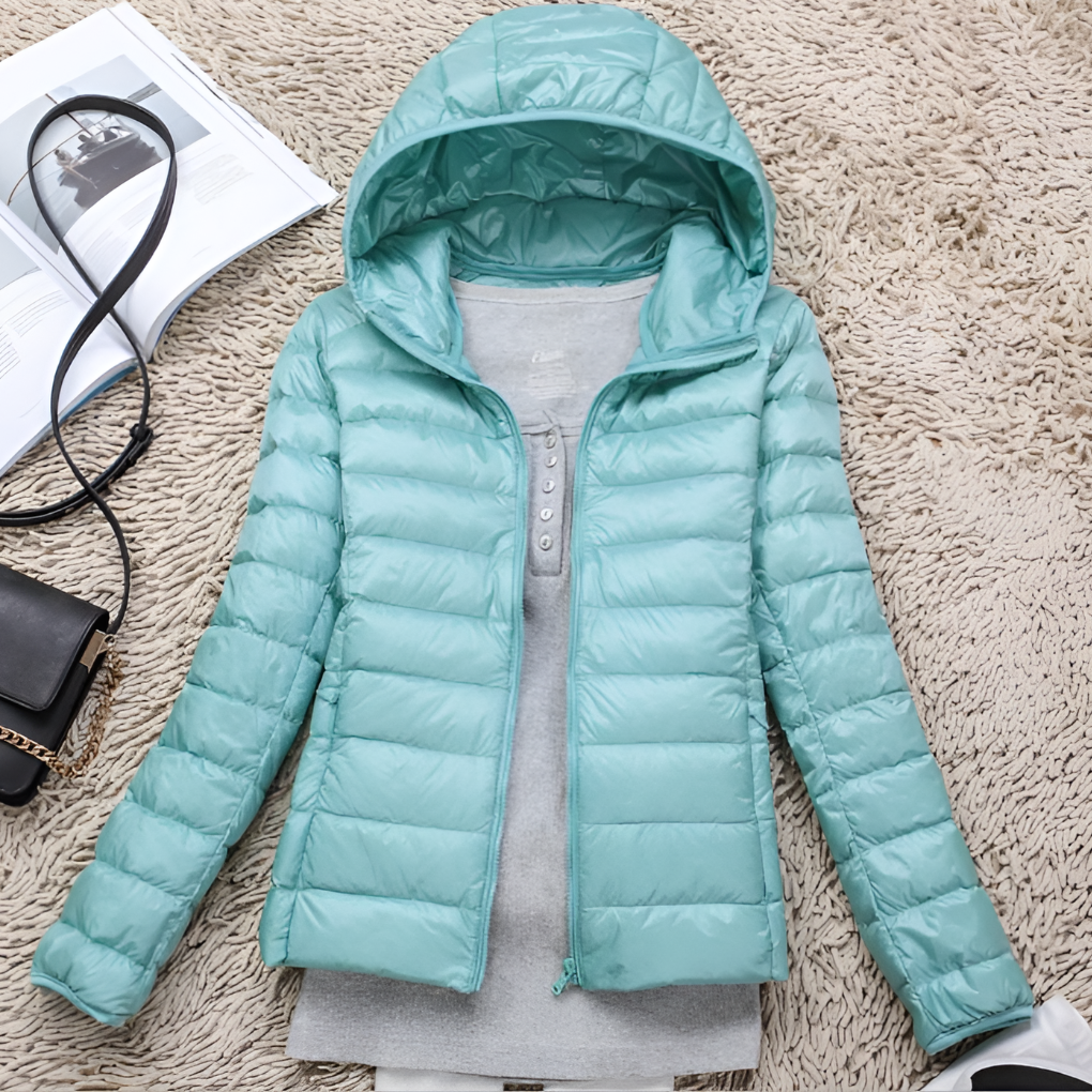 Lightweight women's hooded winter coat. Insulated & packable, great for outdoor adventures and cold weather.