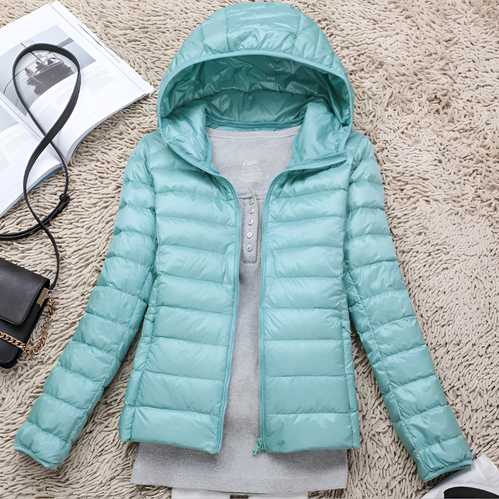 Lightweight women's hooded winter coat. Insulated & packable, great for outdoor adventures and cold weather.