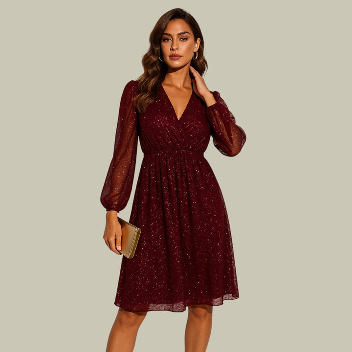 Shimmering long sleeve sequin mini dress, ideal as a party or cocktail dress.