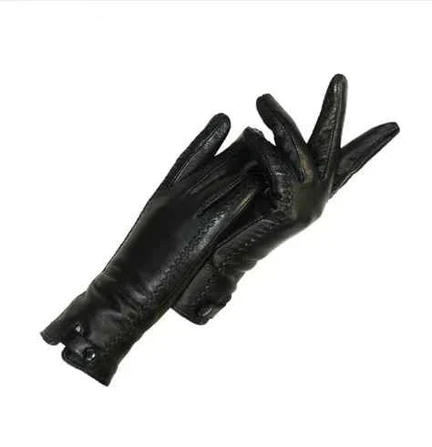 Women's vintage brown leather gloves with warm wool lining. Classic retro style for winter fashion accessories.