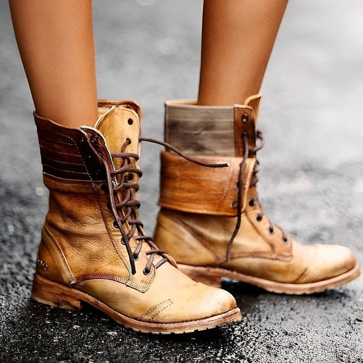 Fashionable women's lace-up ankle combat boots in vintage style, featuring durable construction for rugged wear.
