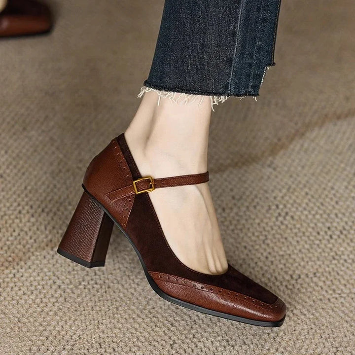 Close-up of women's classic pumps with vintage square toe and block heel