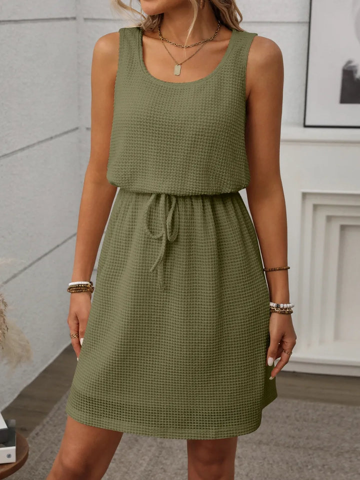 The essential women's waffle knit drawstring mini dress for any occasion.