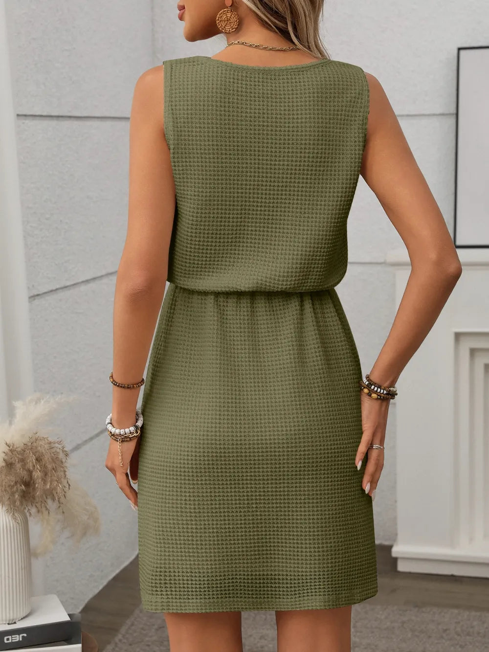 Fashionable waffle knit mini tank dress with a simple yet elegant design.