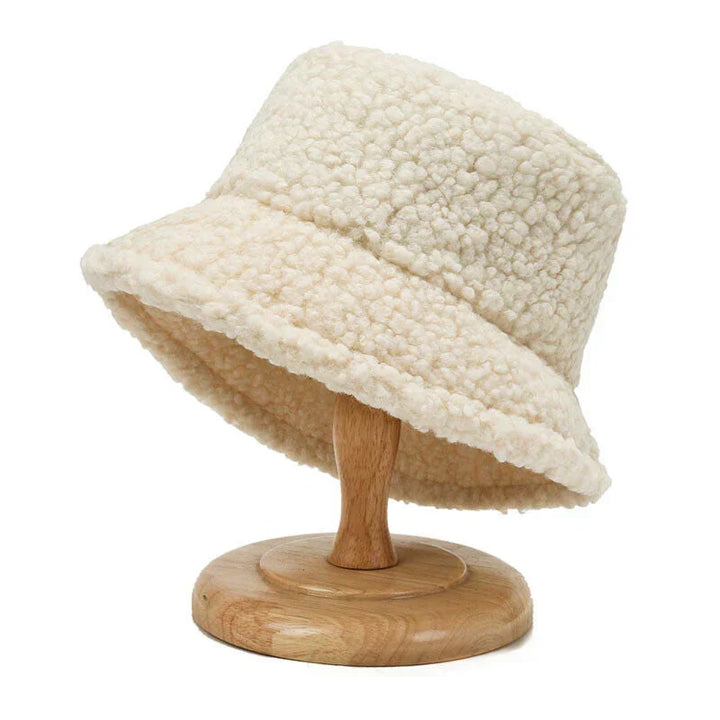 Women's warm teddy bucket hat for stylish winter fashion, a cozy accessory for cold weather.