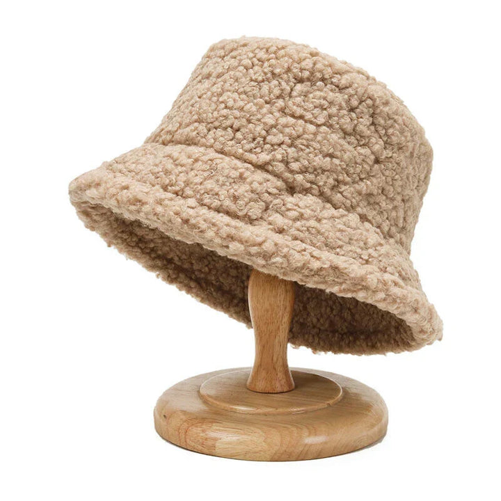 Soft teddy bucket hat for women, providing warmth and comfort in cold weather. A fashionable winter accessory.
