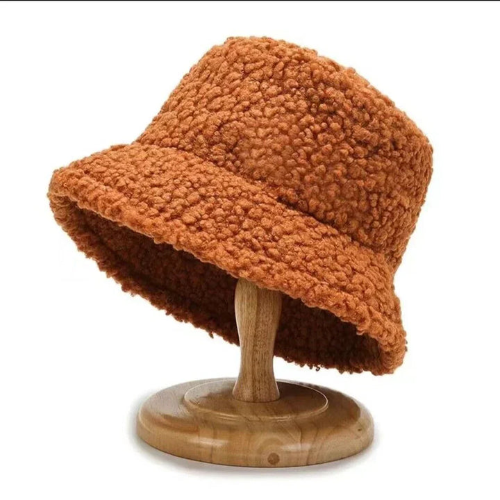 Fashionable women's teddy bucket hat, perfect for winter outings. A stylish and warm headwear accessory.