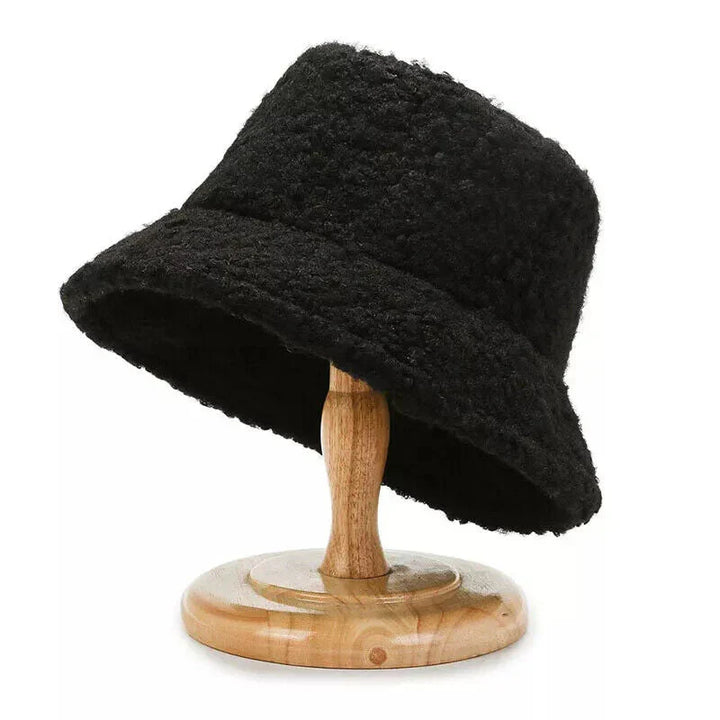 Cozy women's teddy bucket hat, a trendy and warm accessory for winter fashion. Soft and comfortable headwear.