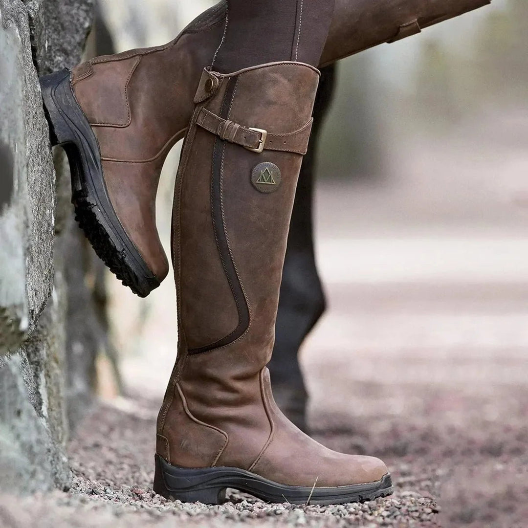 Women's waterproof leather riding boots in black, stylish and durable footwear for outdoor adventures.