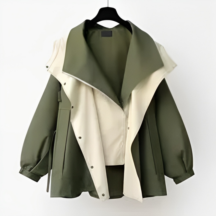 Model wearing a chic women's rain jacket, showcasing its flattering fit and style.