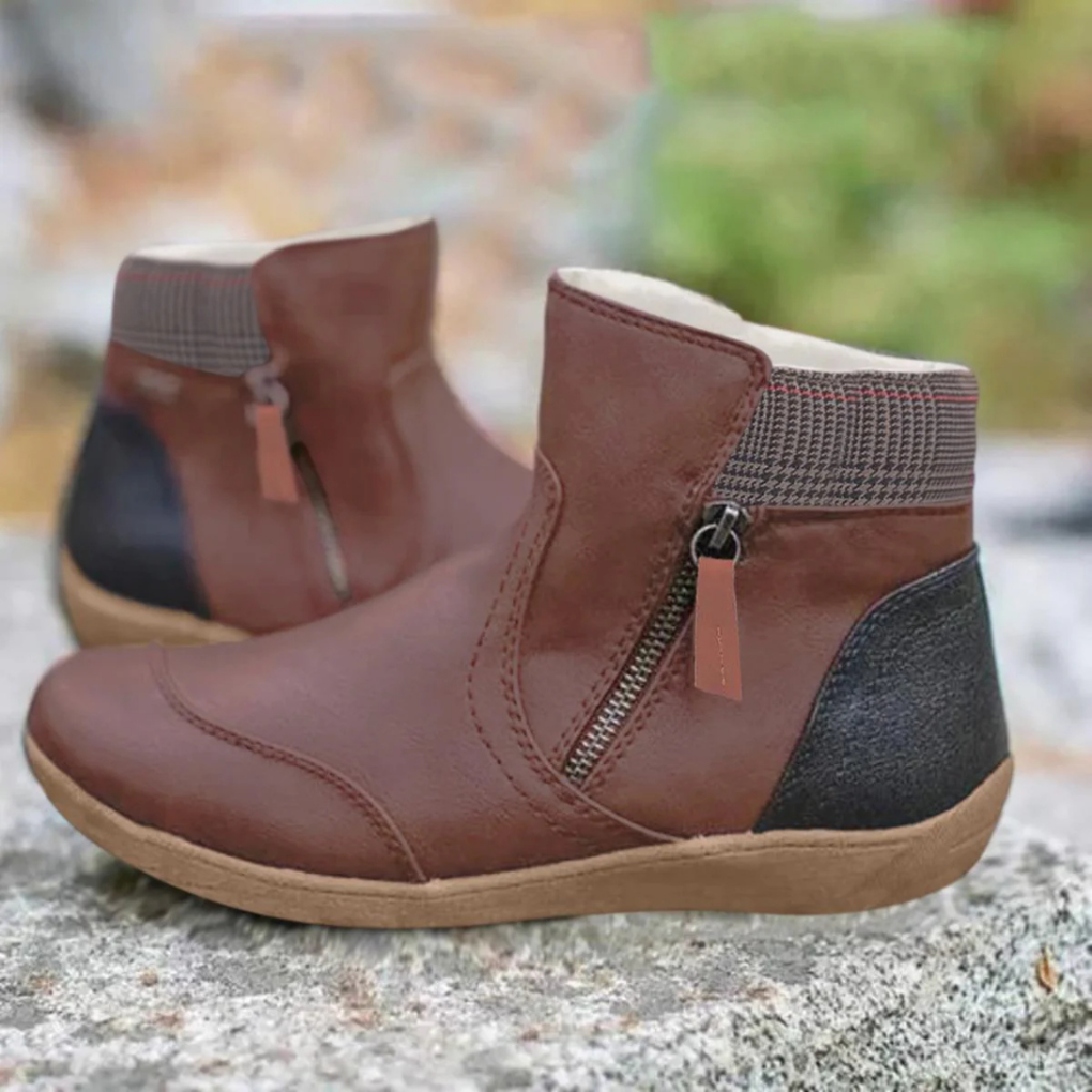 Woman wearing comfortable mid-ankle winter boots for outdoor activities.