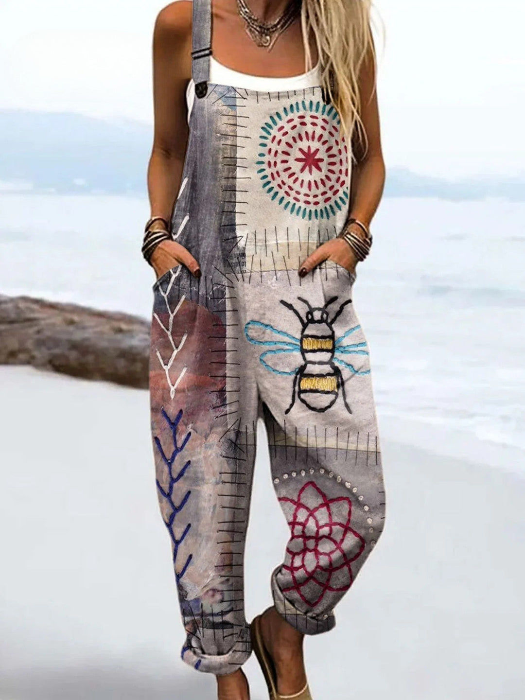 Women's whimsical bee print dungarees jumpsuit. Comfortable, relaxed fit for effortless casual summer style.