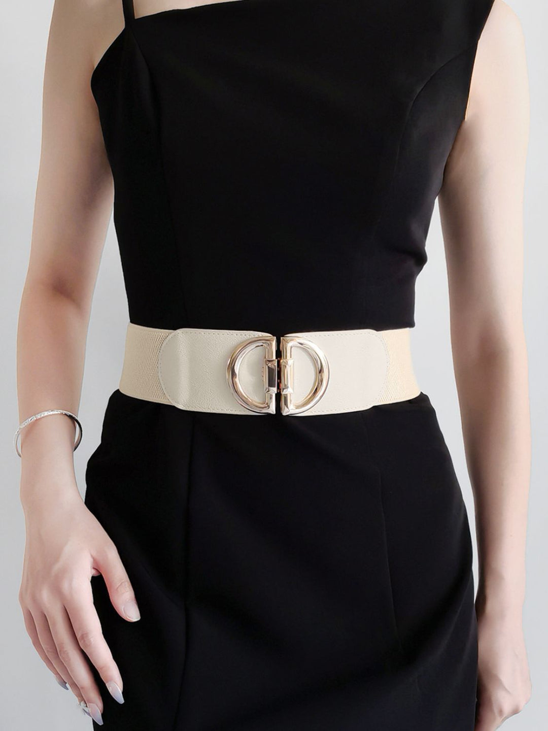 Gold buckle adds flair to this wide stretch elastic women's waist belt