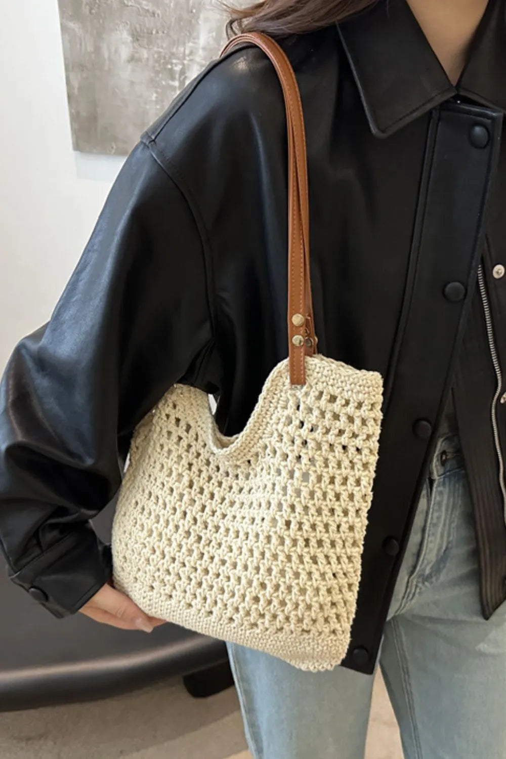 Close-up of the intricate weave on a natural fiber cotton shoulder bag for women.
